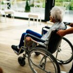 Tall Tales & Murder : diffusion, intrigue et casting A caregiver assists a senior adult in a wheelchair at a nursing home in Prague, Czech Republic.