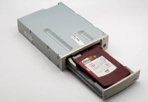 A vintage DittoMax tape drive showcasing an inserted 7GB cartridge.