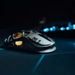 Sleek metallic gaming mouse on a high-tech glowing mat, perfect for esports.