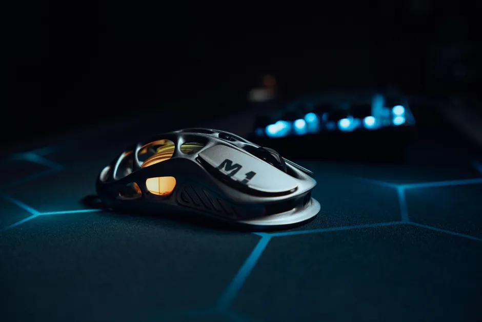 Sleek metallic gaming mouse on a high-tech glowing mat, perfect for esports.